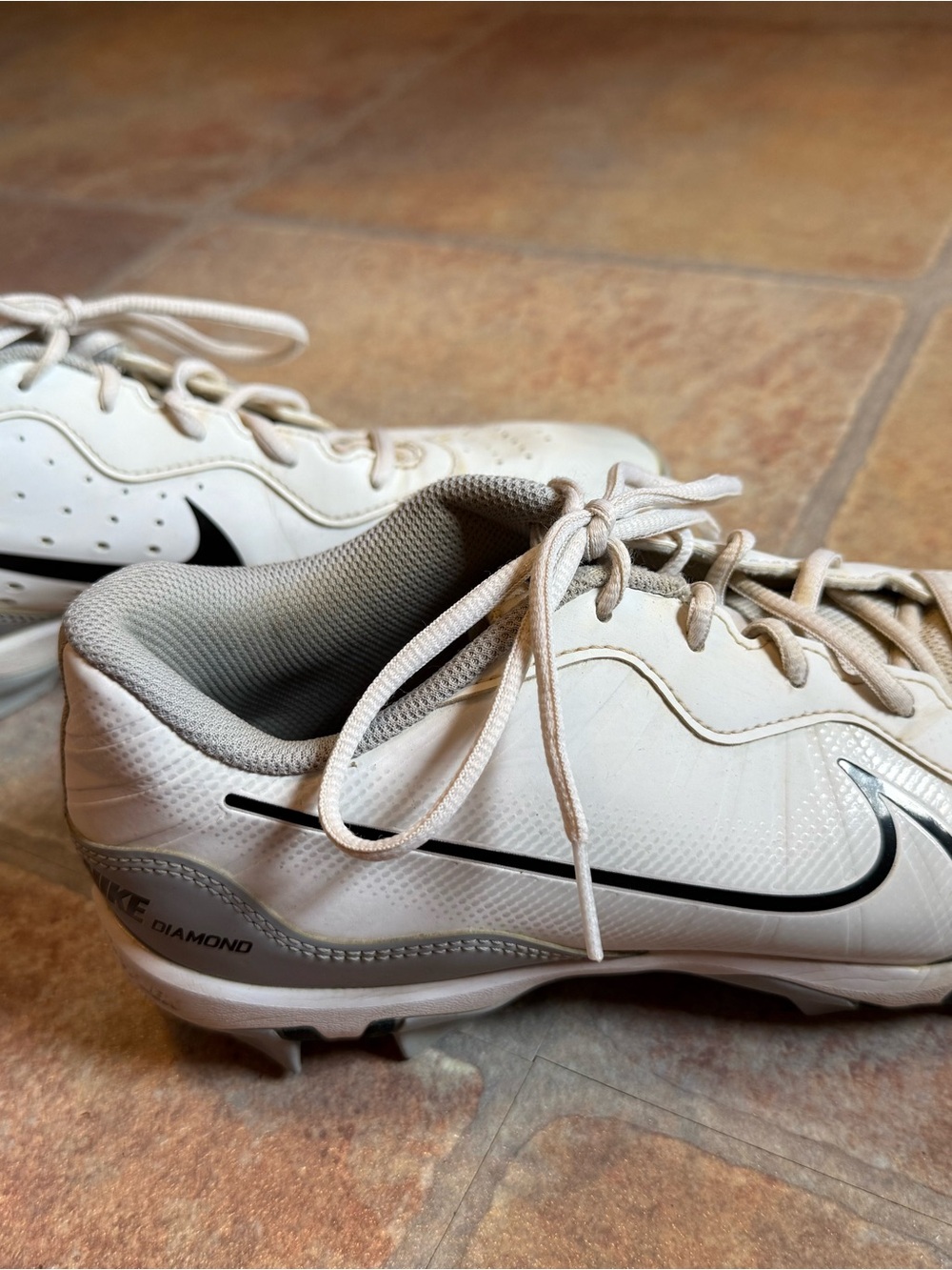 Nike White Cleats with Black Swoosh and Silver Accents